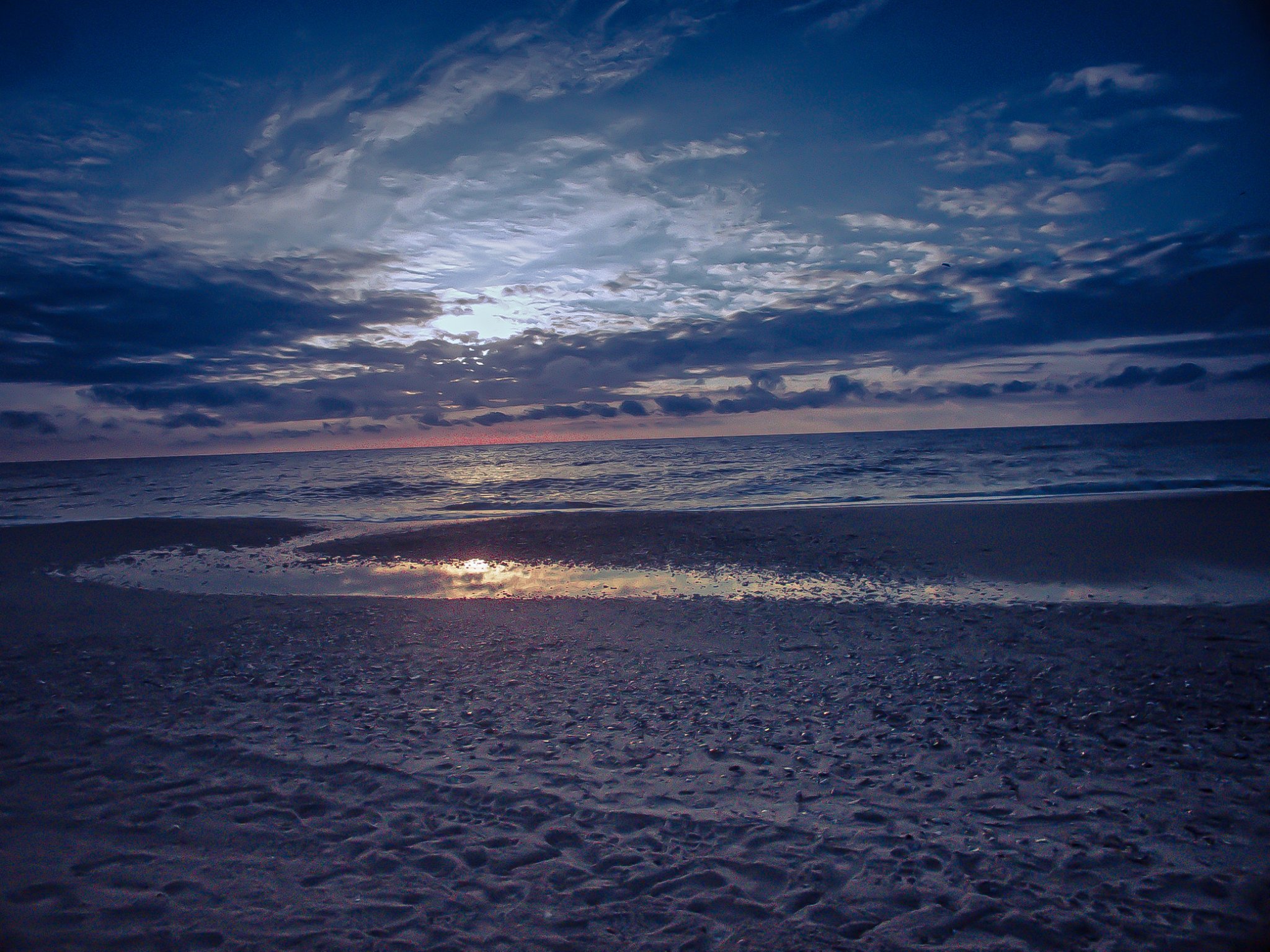 Moon over the ocean at dawn