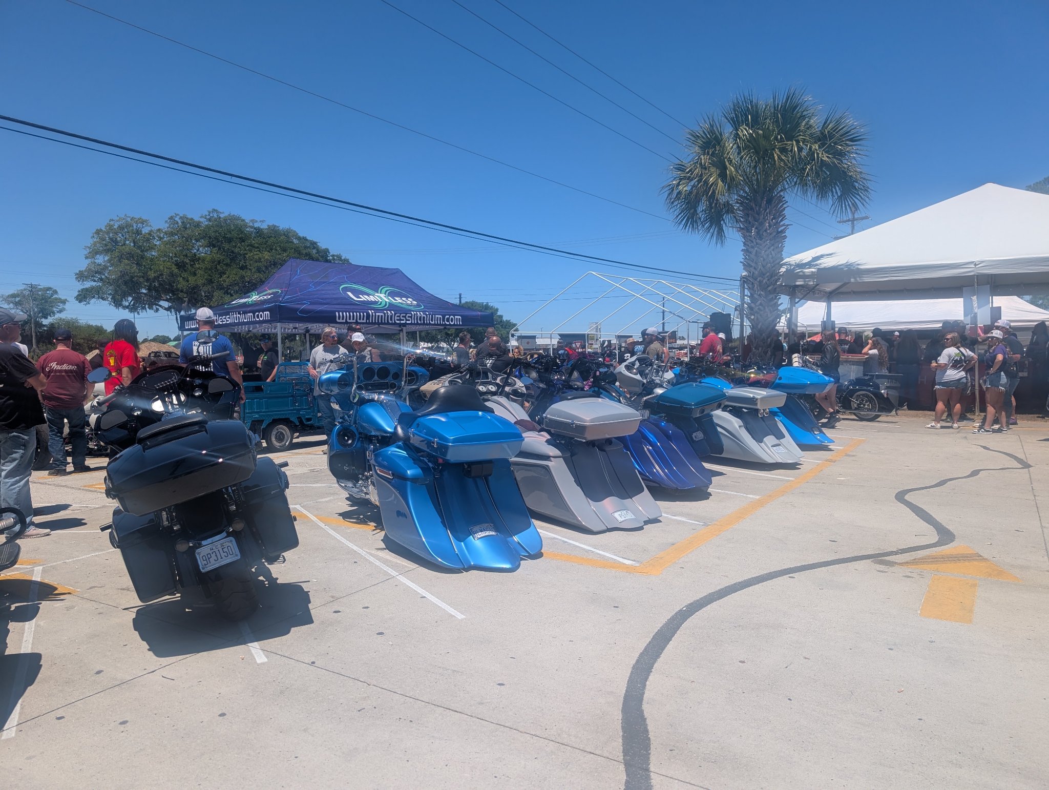 Lineup of bagger motorcycles parked at the rally
