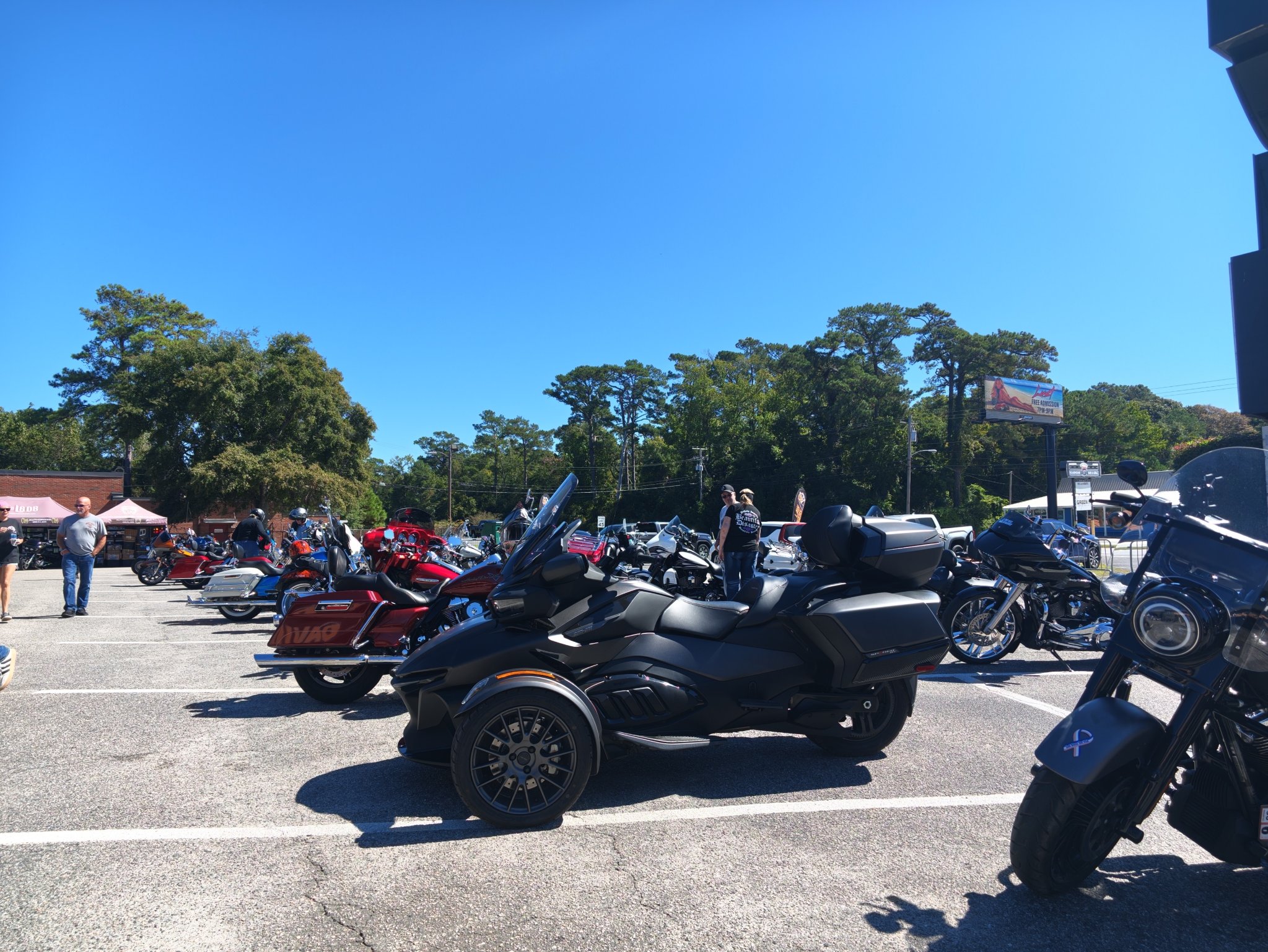 Motorcycles and a trike parked at a Grand Strand rally